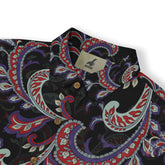 Black shirt with vibrant paisley pattern in red, purple, and white.