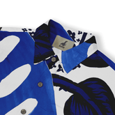Blue and white patterned shirt with tropical design, featuring.