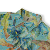 Colorful floral-patterned shirt with tropical design, featuring.