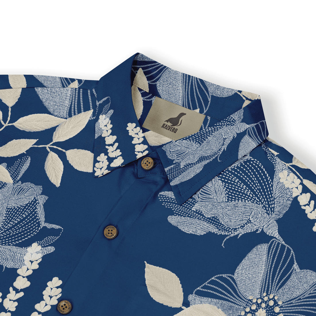 Blue floral shirt with white patterns, wooden buttons, and Kalvero.