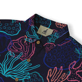 Vibrant navy shirt with colorful coral and sea life print, featuring.