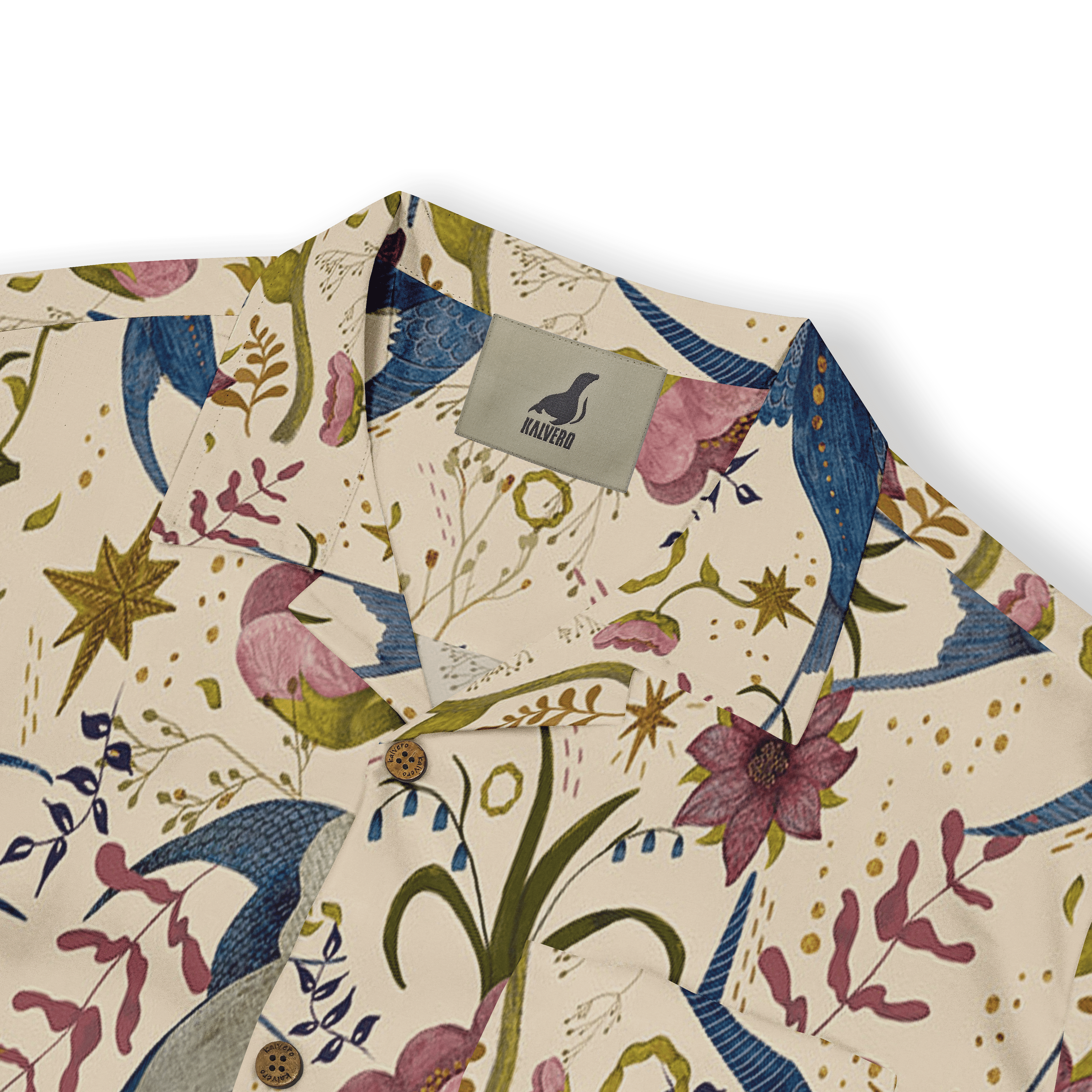 Floral-patterned shirt with birds, flowers, and stars on a cream.
