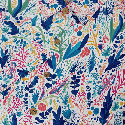 Colorful floral pattern shirt with wooden buttons on white background.