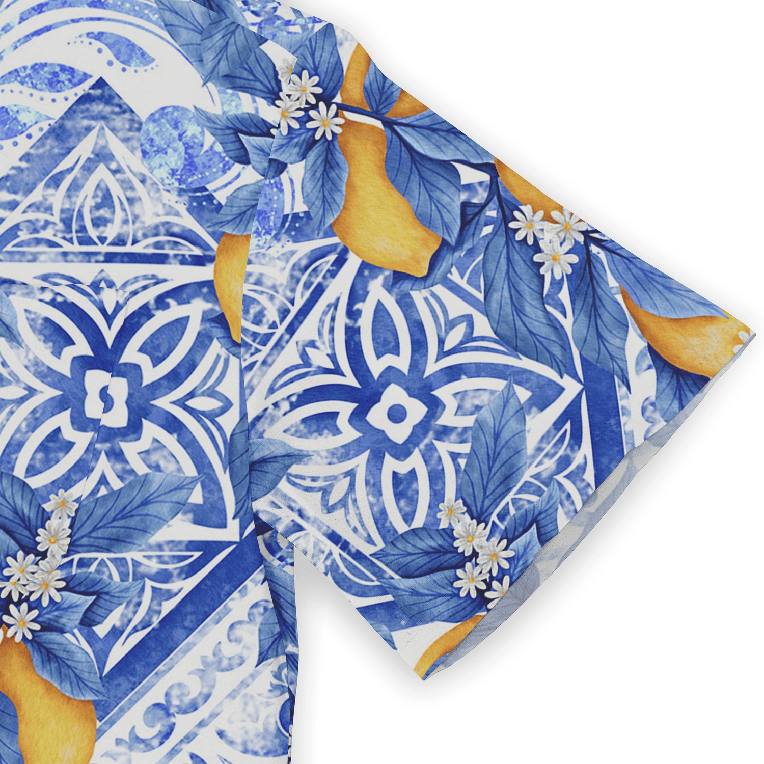 Blue and white patterned fabric with floral and citrus designs.