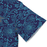Navy blue fabric with turquoise floral and vine patterns, featuring.