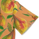 Vibrant pear print scarf with colorful fruit and leaves on a warm.