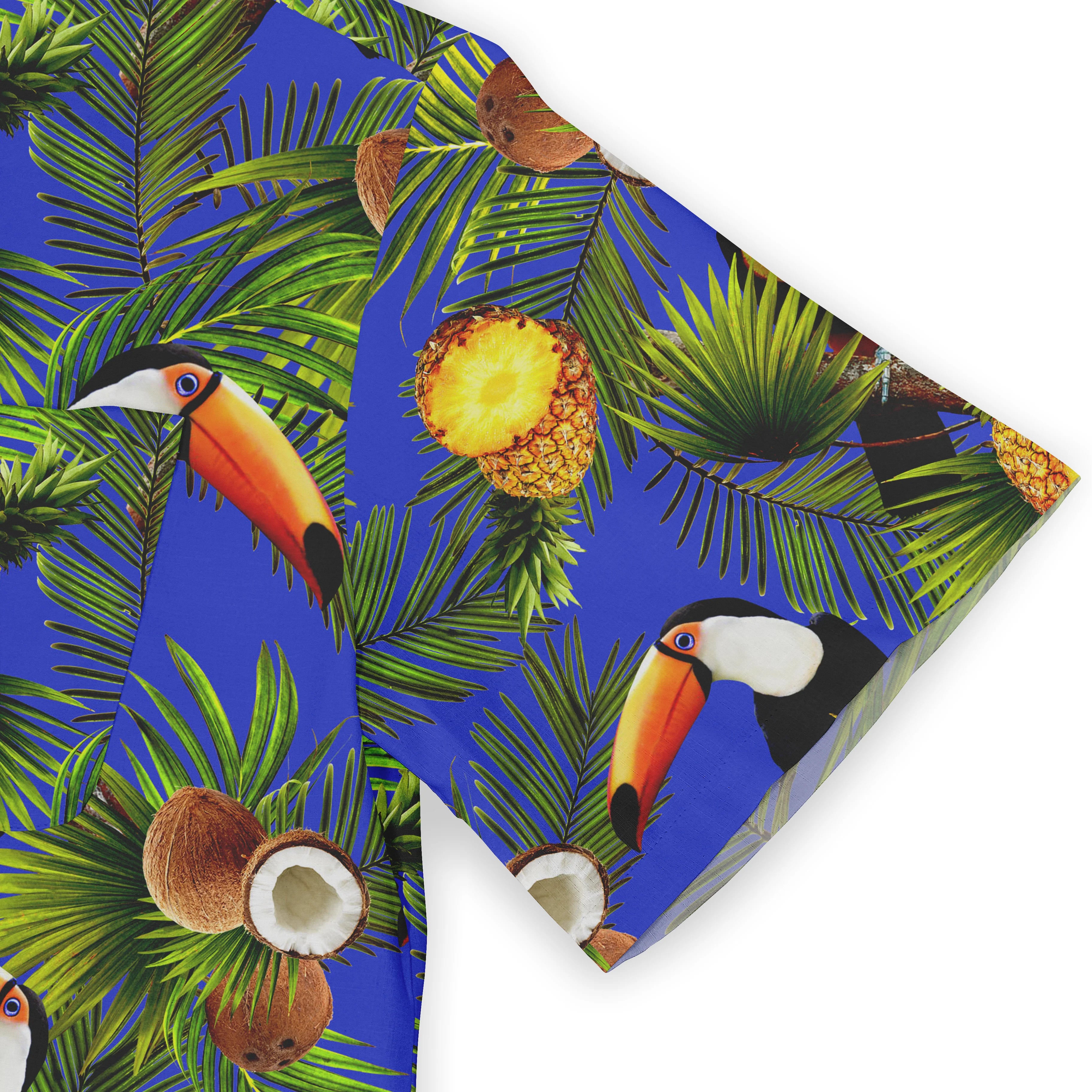 Tropical print fabric with toucans, pineapples, coconuts, and palm.