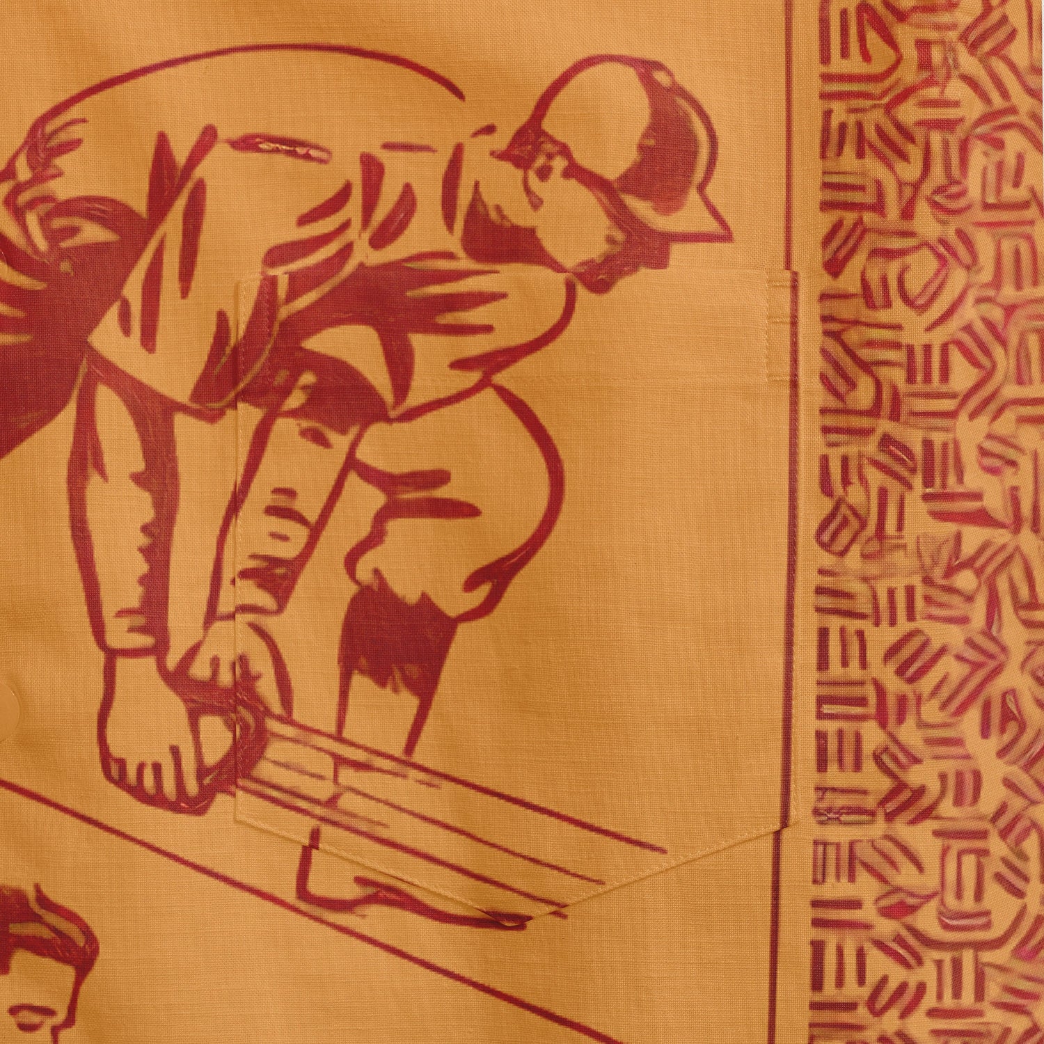 Red and gold textile with a worker figure and geometric patterns.