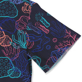 Vibrant coral reef pattern scarf in navy, pink, blue, and teal.