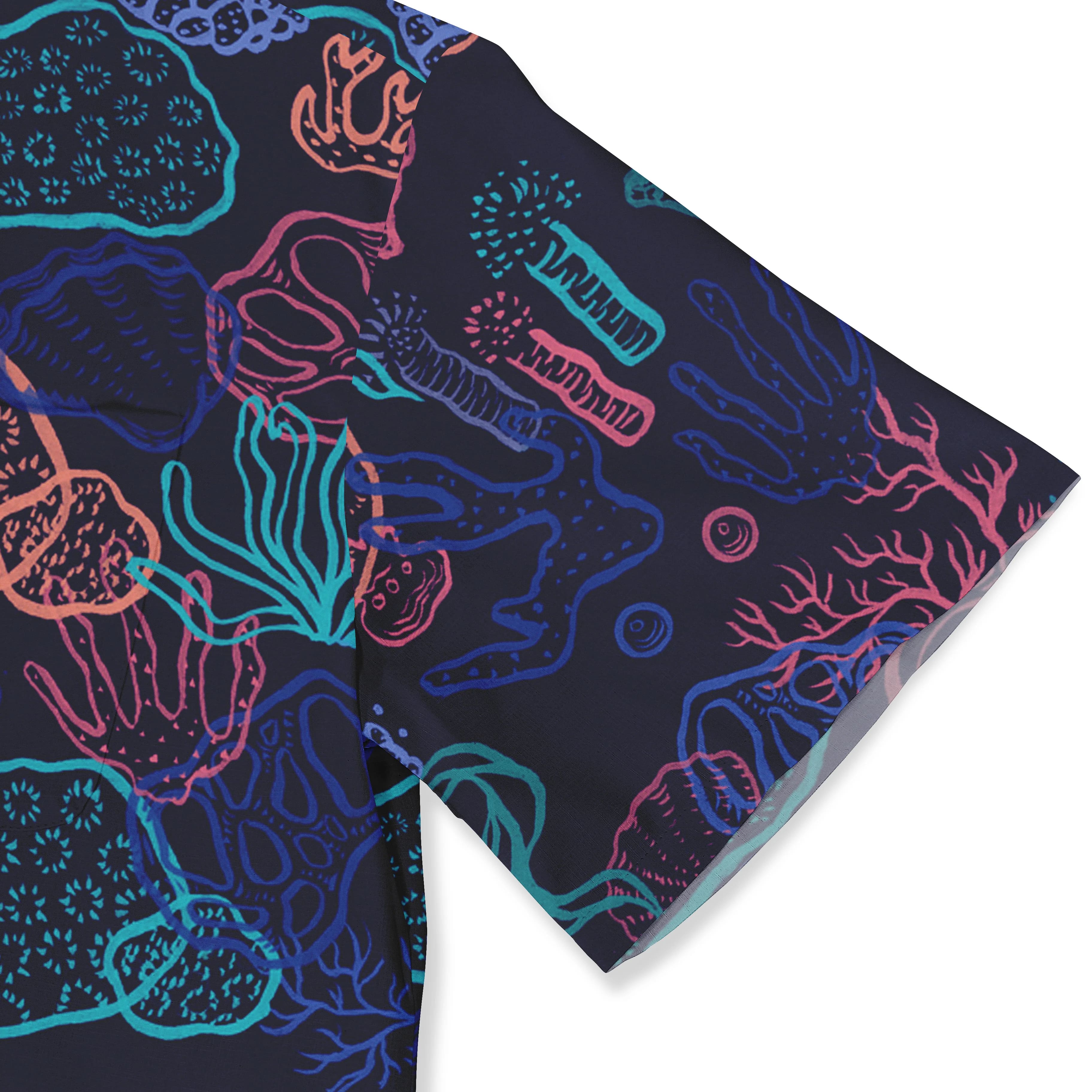 Vibrant coral reef pattern scarf in navy, pink, blue, and teal.