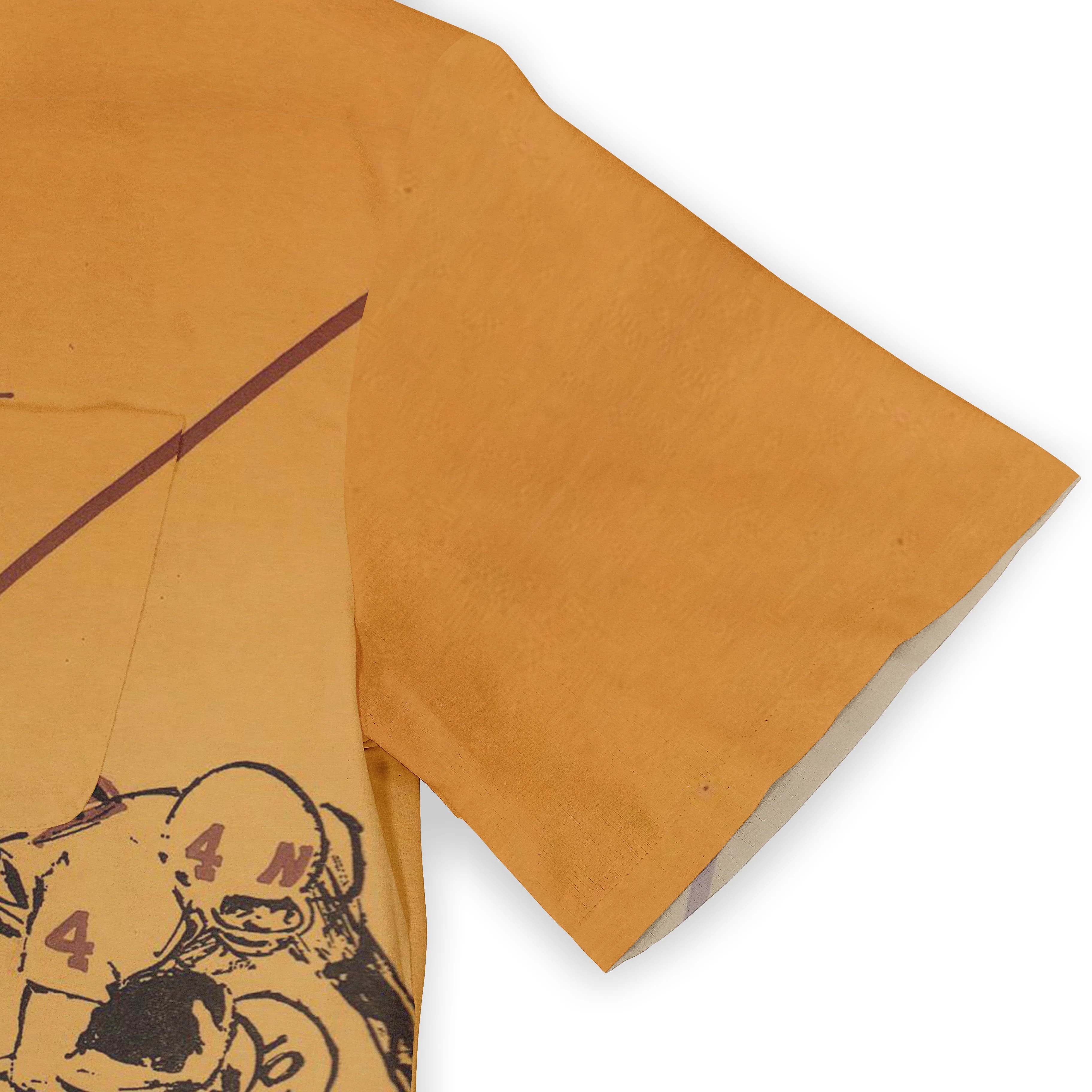 Orange T-shirt with graphic print of football players, featuring.