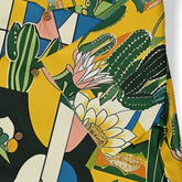Vibrant cactus and floral pattern shirt with bold colors and wooden.
