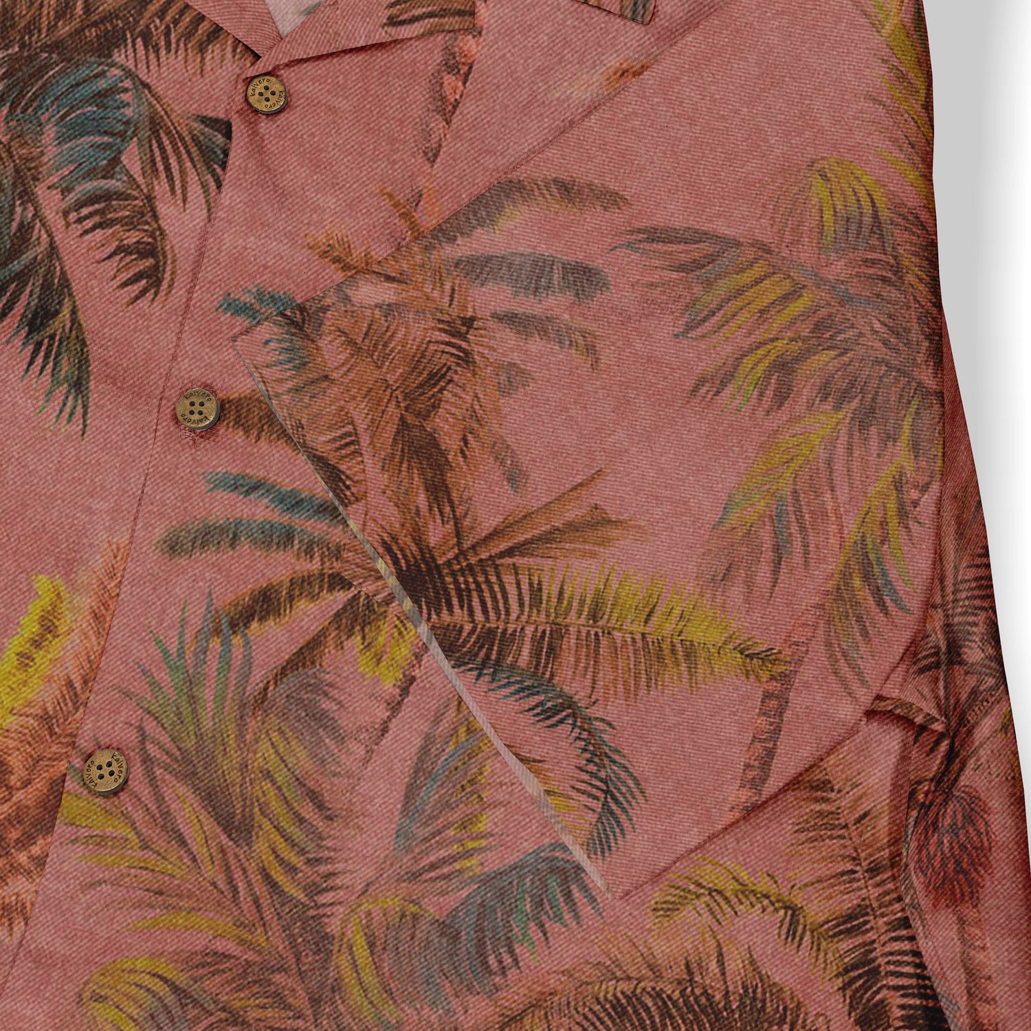 Pink shirt with tropical palm leaf print and wooden buttons.