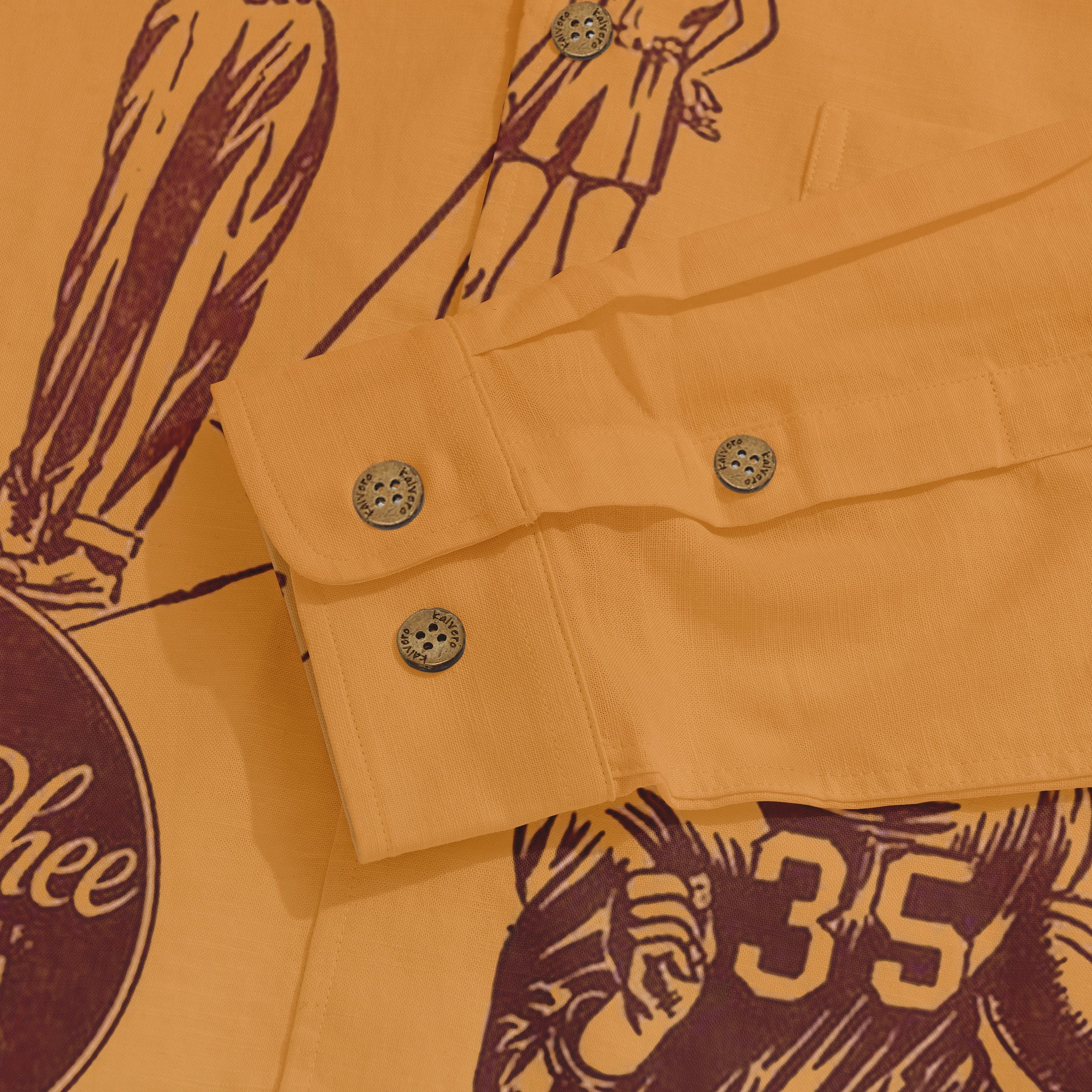 Orange shirt with maroon graphic print, featuring buttons and cuff.