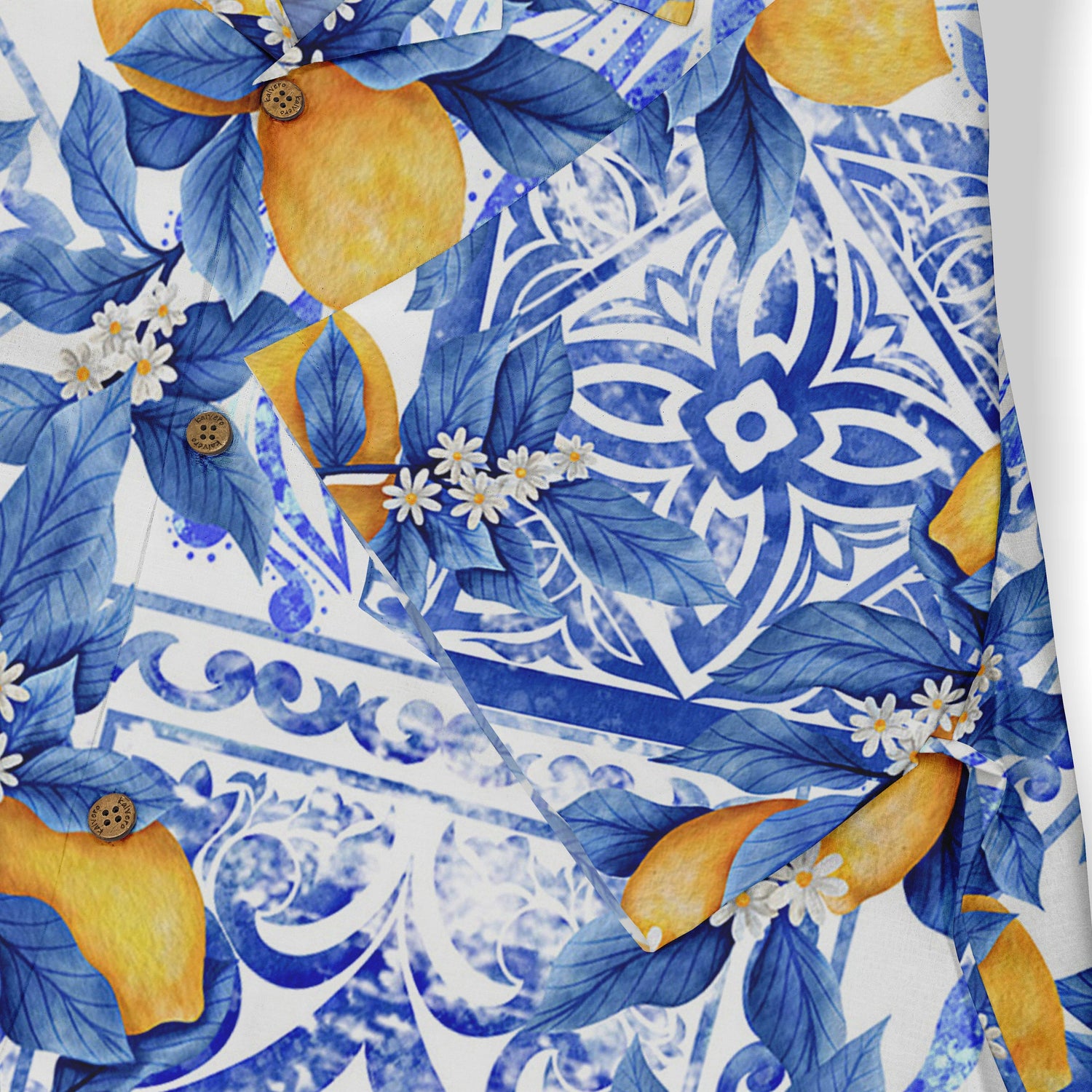 Vibrant blue and white floral pattern with yellow lemons and wooden.