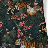 Tropical shirt with tiger, leaves, and flowers on dark background.