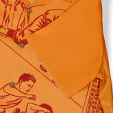Orange shirt with red graphic print, featuring buttons and a bold.
