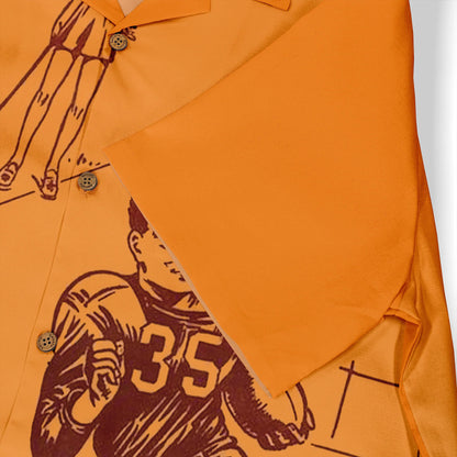Orange polo shirt with basketball player graphic, number 35.