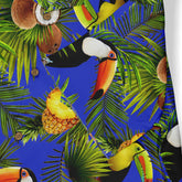 Vibrant tropical fabric with toucans, coconuts, pineapples, and palm.
