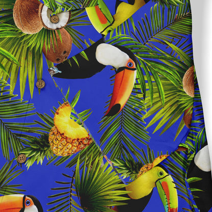Vibrant tropical fabric with toucans, coconuts, pineapples, and palm.