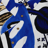 Blue and white floral shirt with wooden buttons, bold patterns.