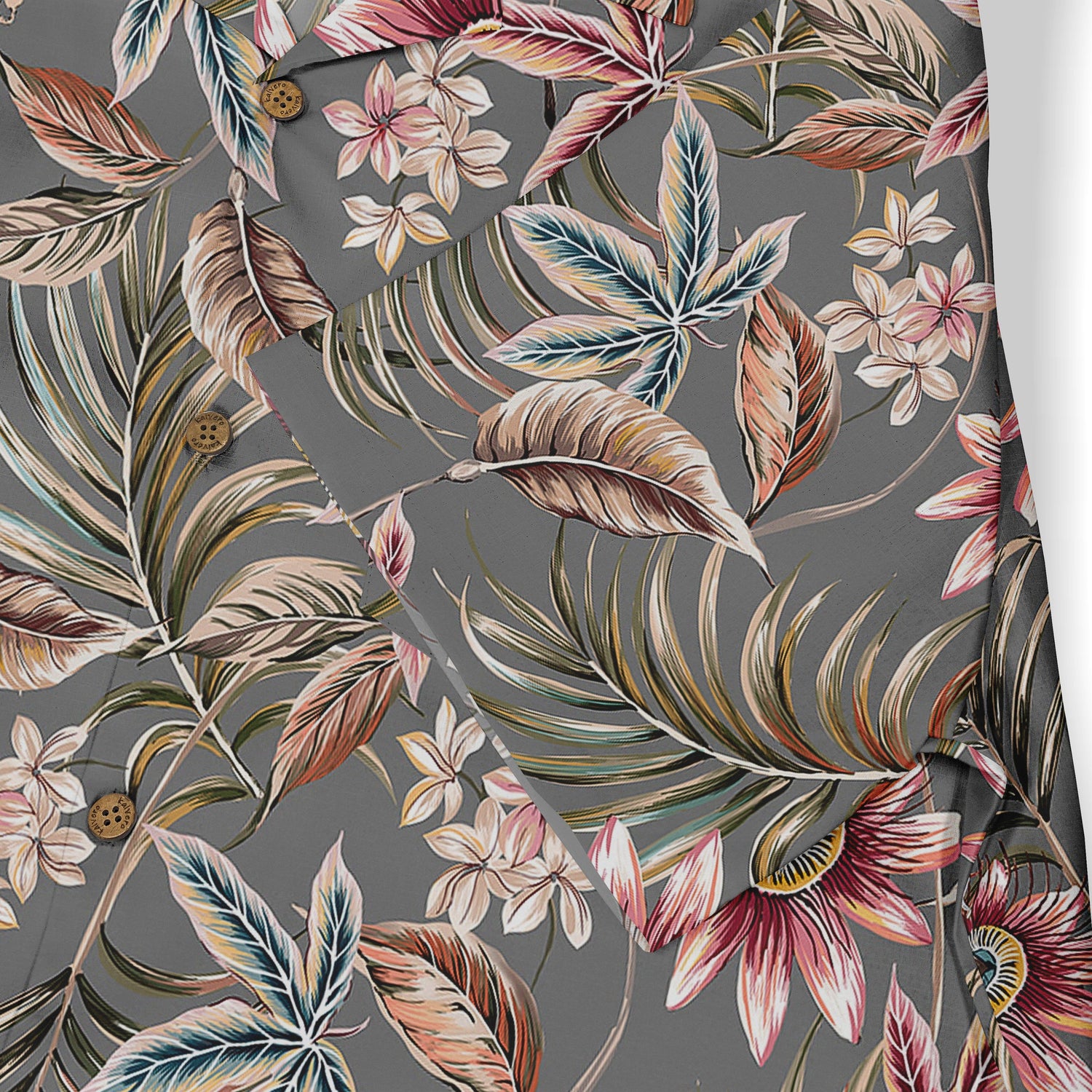 Floral-patterned shirt with tropical leaves and flowers on a dark.