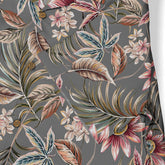 Floral-patterned shirt with tropical leaves and flowers on a dark.
