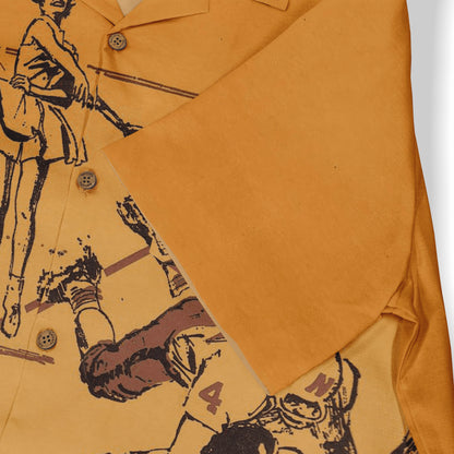 Mustard yellow shirt with graphic print of vintage-style figures.