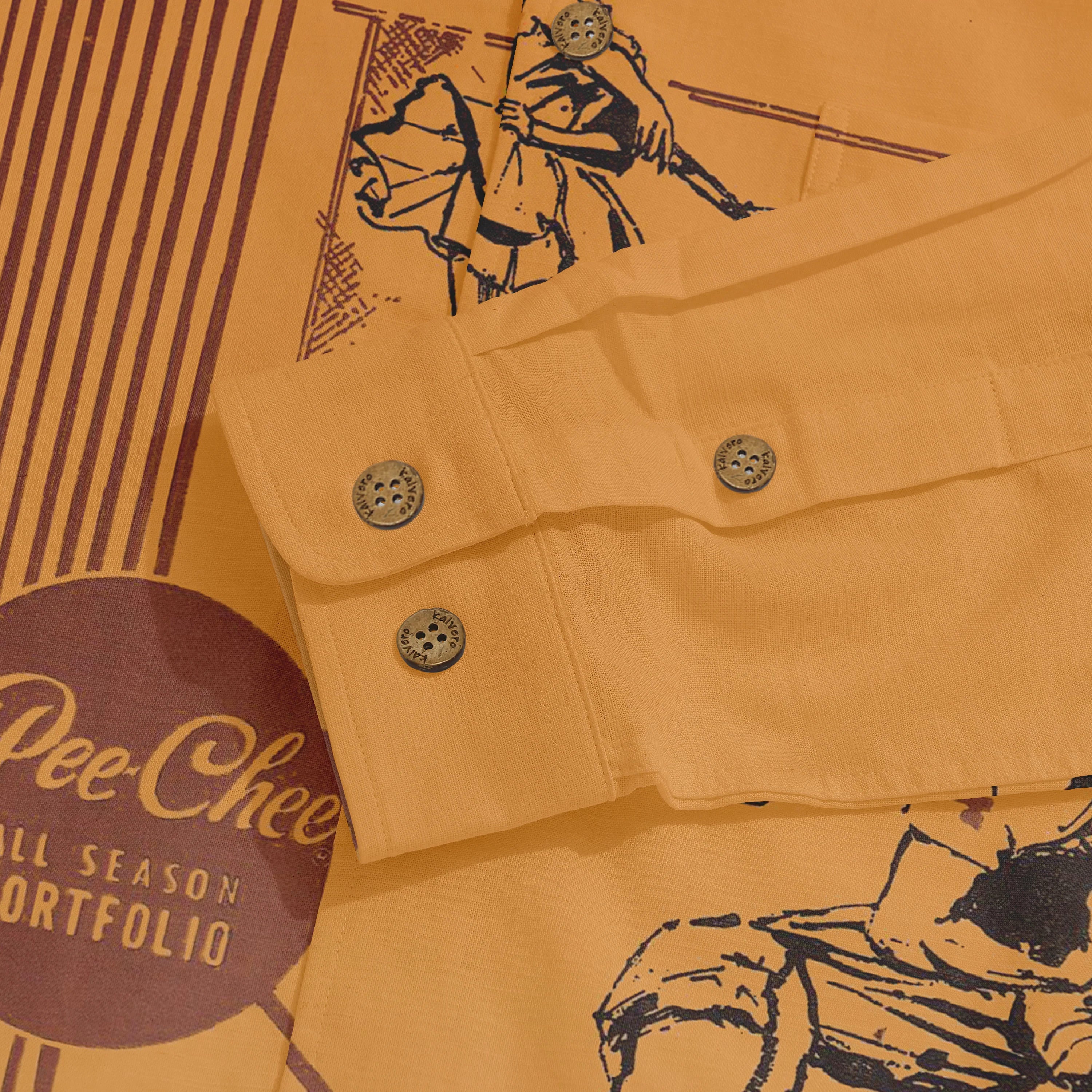 Mustard yellow shirt with graphic print and branded buttons, styled.