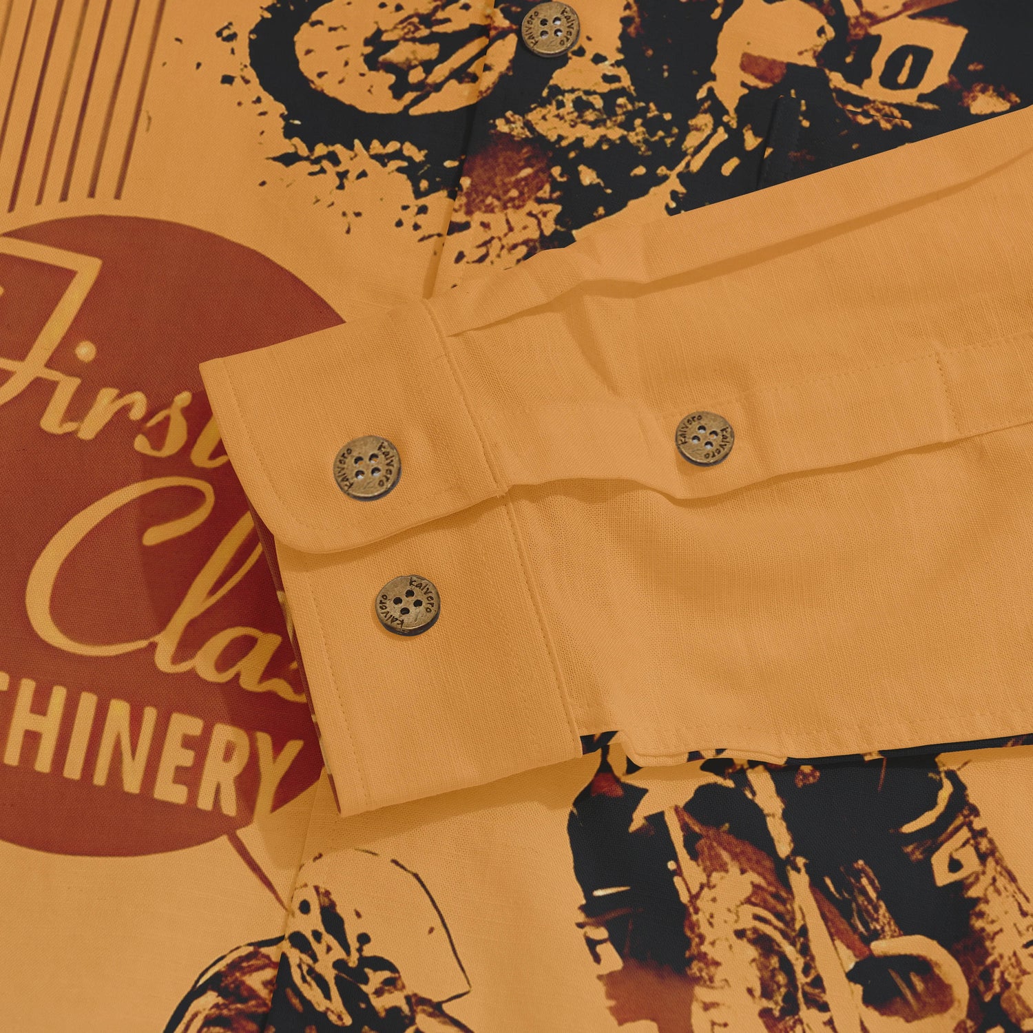 Orange shirt with graphic print, &quot;First Class Machinery&quot; text.