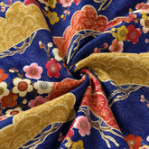 KALVERO Japanese Skyscape: fabric detail showing ochre and rust Japanese pines with plum blossoms over an indigo geometric lattice.