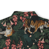 Tropical shirt with tigers, pink flowers, and green leaves on a dark.