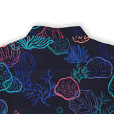 Dark blue shirt with vibrant coral and sea life pattern in pink.