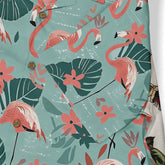 Tropical flamingo print shirt with vibrant pink birds, green leaves.