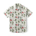White shirt with palm trees and pink flowers pattern.