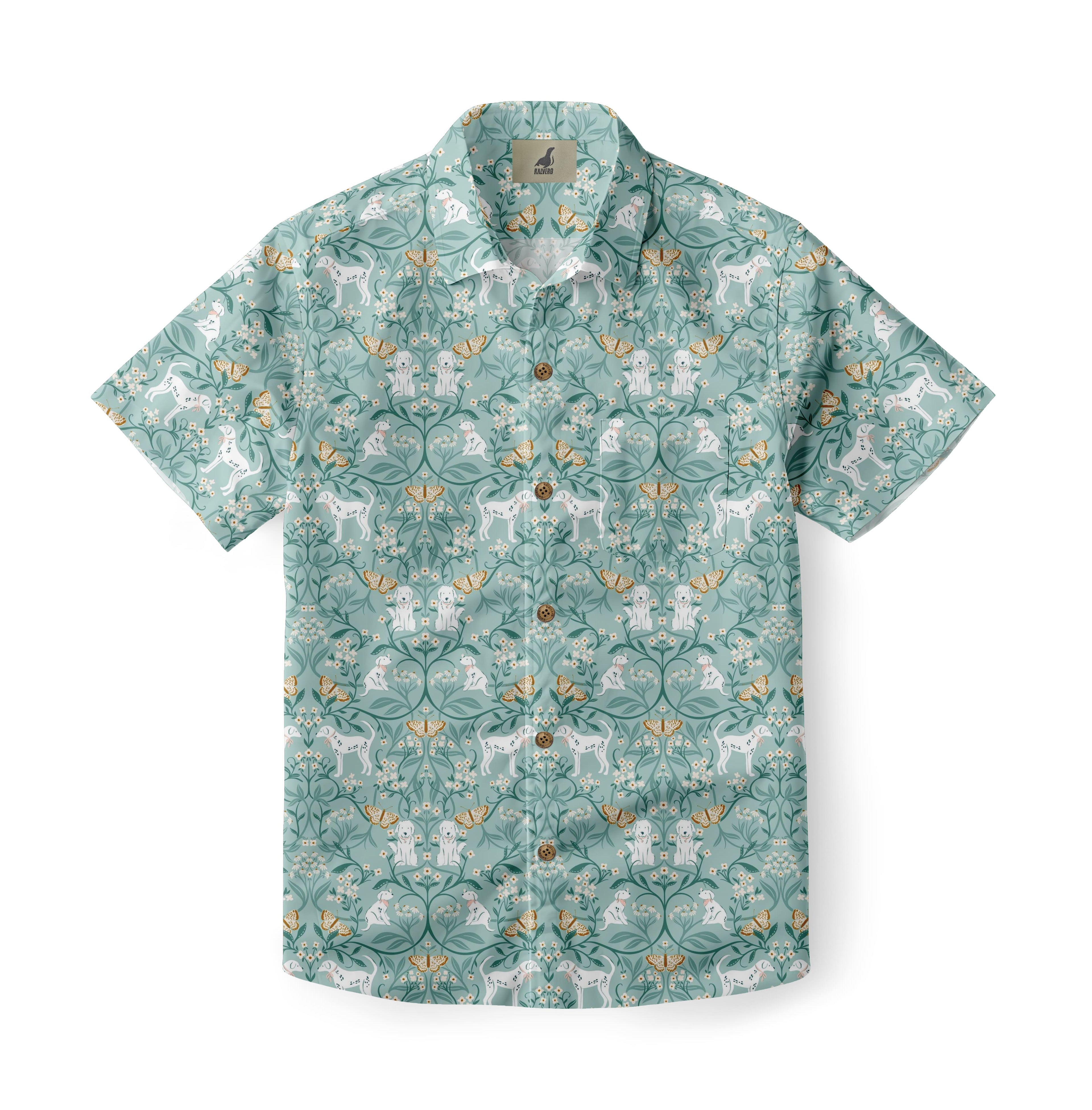 Teal shirt with white dogs, butterflies, and floral patterns.