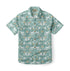 Teal shirt with white dogs, butterflies, and floral patterns.