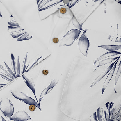 White shirt with blue tropical leaf print and wooden buttons.