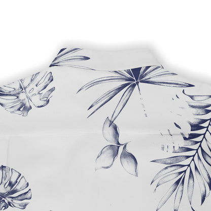 White fabric with navy blue tropical leaf print, featuring monstera.