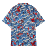 Blue shirt with red koi fish and wave patterns.