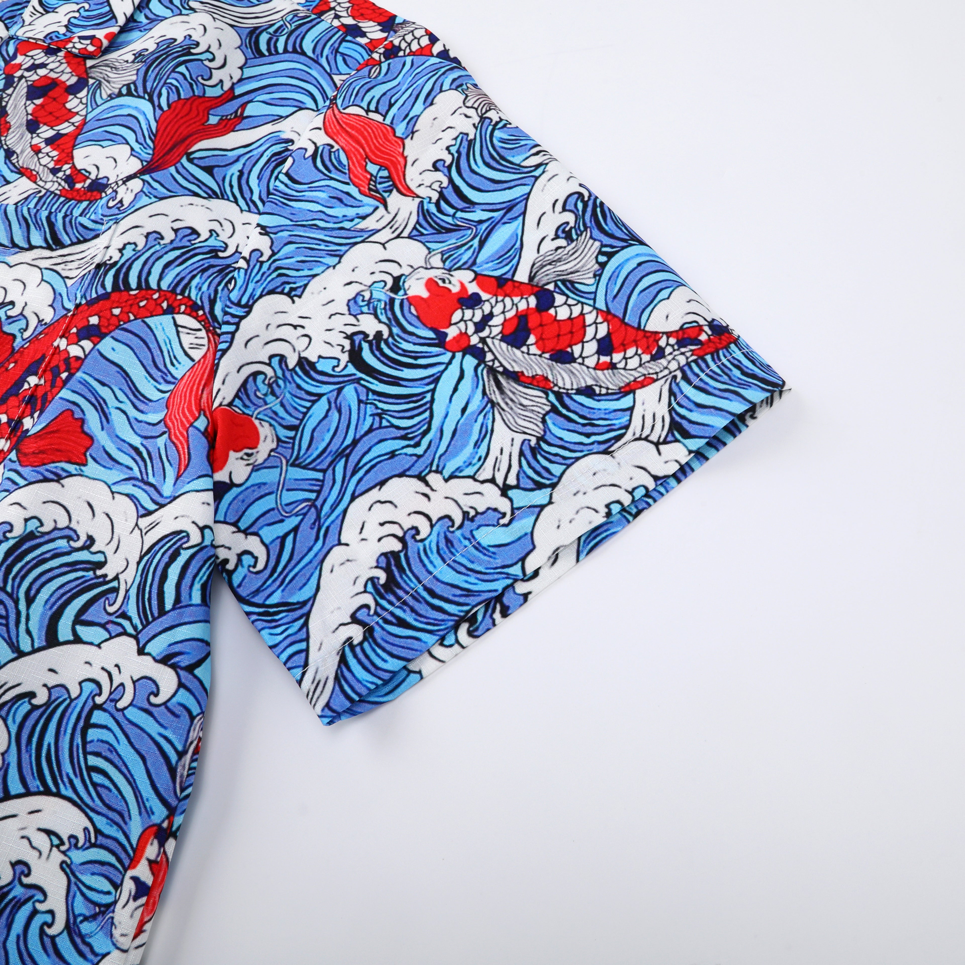 Blue wave pattern fabric with red fish design.