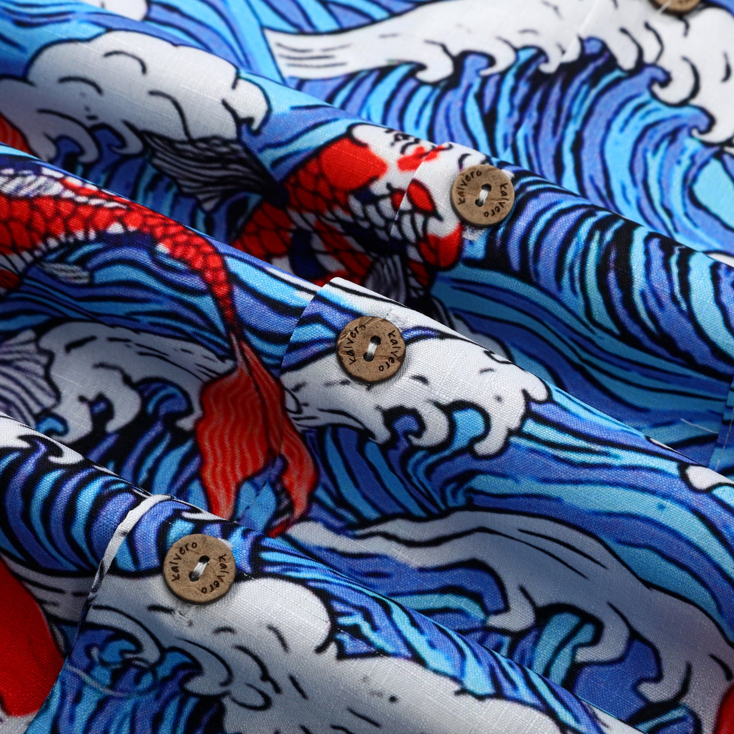 Blue wave pattern fabric with red fish and wooden buttons.