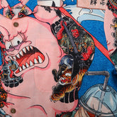 Colorful shirt with cartoon and traditional art designs.