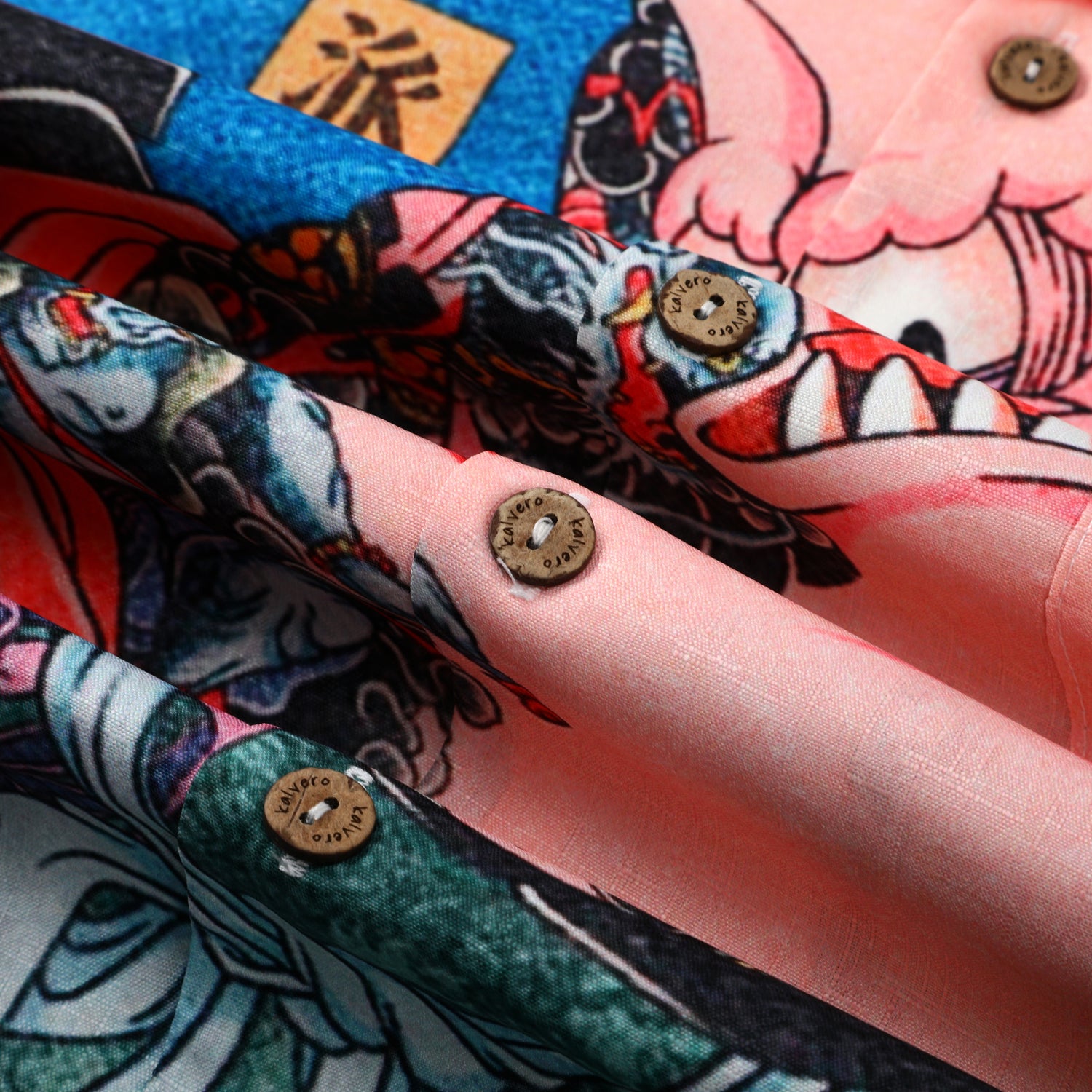 Colorful tattoo-style fabric with buttons, folded.