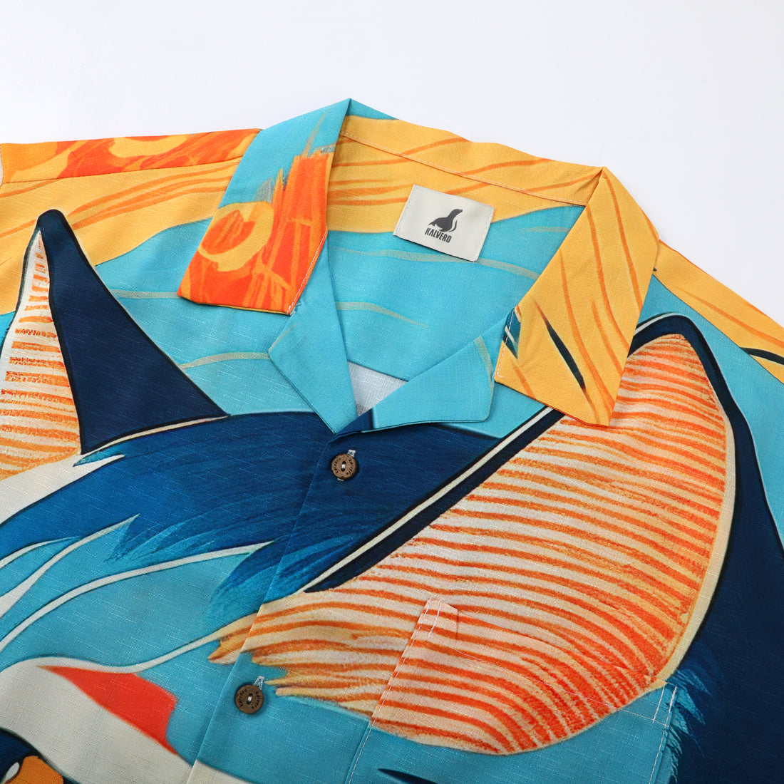 Colorful shirt with fox design, blue and orange stripes.