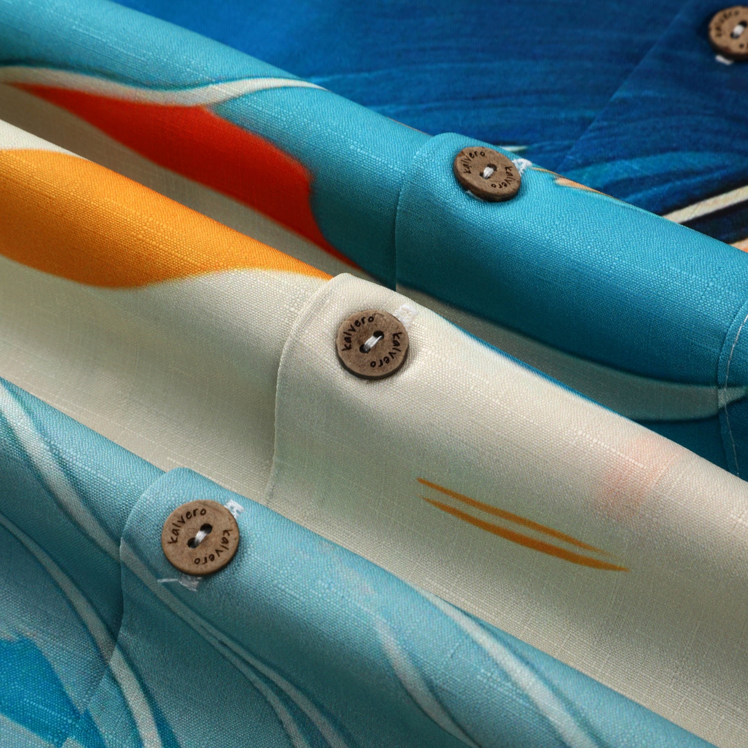 Colorful fabric swatches with buttons, showcasing vibrant patterns.