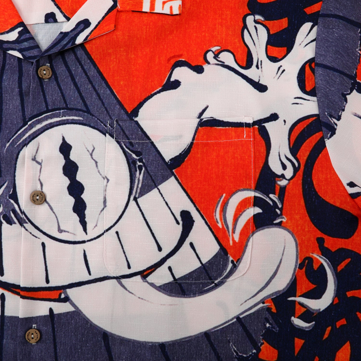 Orange shirt with cartoon clock design, blue stripes.