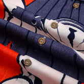 Folded shirts with orange, navy, and white patterns.