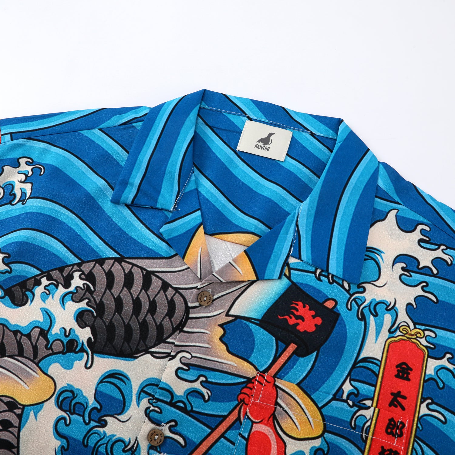 Blue shirt with wave pattern, red flag, and gold text.