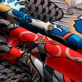 Colorful fabric rolls with bold patterns and buttons.